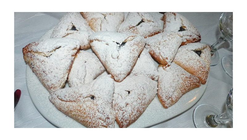 Hamantashen served dusted with powdered sugar- Wikipedia 