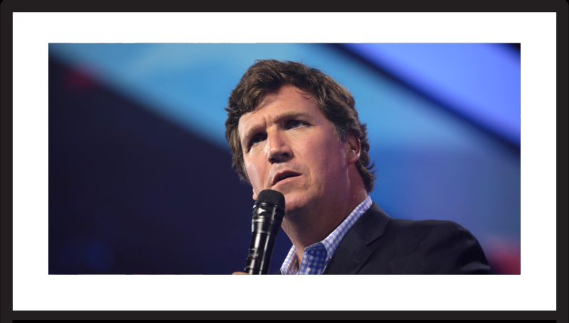 Tucker Carlson speaking with attendees at the 2022 AmericaFest at the Phoenix Convention Center in Phoenix, Arizona- SOURCE: Wikipedia