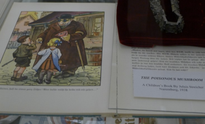 Der Giftpilz is a children's book published by Julius Streicher in Nuremberg, Nazi Germany in 1938. The title is German for "the poisonous mushroom/toadstool". The book was intended as antisemitic propaganda. The text is by Ernst Hiemer, with illustrations by Philipp Rupprecht (also known as Fips); the title alludes to how, just as it is difficult to tell a poisonous mushroom from an edible mushroom, it is difficult to tell a Jew apart from a Gentile. The book attempts to "warn" German children about the dangers allegedly posed by Jews to them personally, and to German society in general.
Photo taken in 2015 in the former International Museum of World War II|The International Museum of World War II in Natick, Massachusetts, USA. The museum existed from 1999 to 2019 and exhibited a by-reservation-only collection of 7,000+ artifacts. - wikipedia