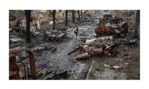 Russia Ukraine War | A woman walks amid destroyed Russian ta… | Flickr
