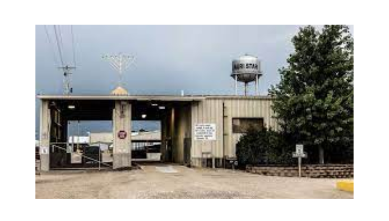 A large menorah, a candalabrum lit during the eight-day Jewish celebration of Hanukkah, stands above the entrance to the Agri-Star meat-processing plant in the eastern Iowa small town of Postville - PICRYL - Public Domain Media Search Engine 