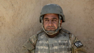 An interpreter rests near a wall in Ahmaday, Ghazni province, Afghanistan, July 7, 2012. (U.S. Army/Spc. Andrew Baker) military.com