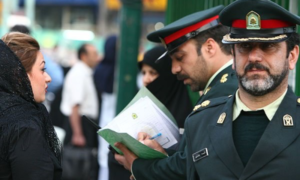 A religious policeman lecturing and reprimanding an Iranian woman-wikipedia