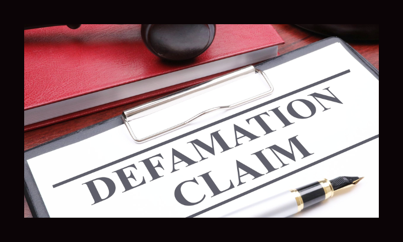 Defamation Claim Description: A picture of a clipboard with defamation claim written across the top together with a gavel, block and red book.- pix4free.org