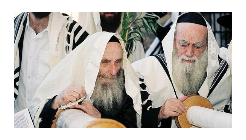 Haredi Jewish men during a Torah reading- WIKIPEDIA