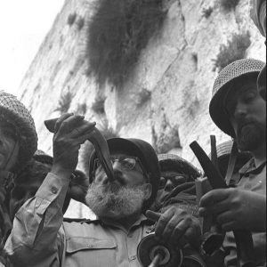 Six Day War. Army chief chaplain rabbi Shlomo Goren, who is surrounded by IDF soldiers, blows the shofar in front of the western wall in Jerusalem.(Source: Wikipedia)